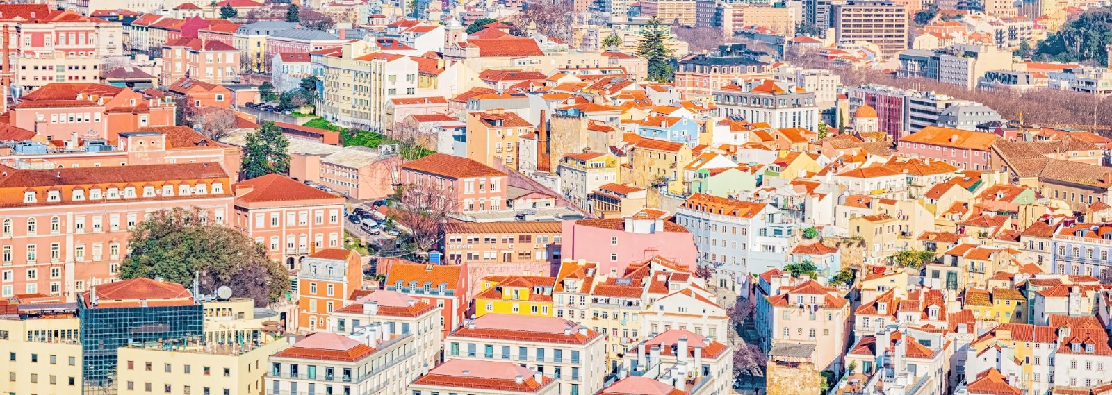 Panoroma of Lisbon and its colourful buildings - some of them renovated thanks to Golden Visa investments.