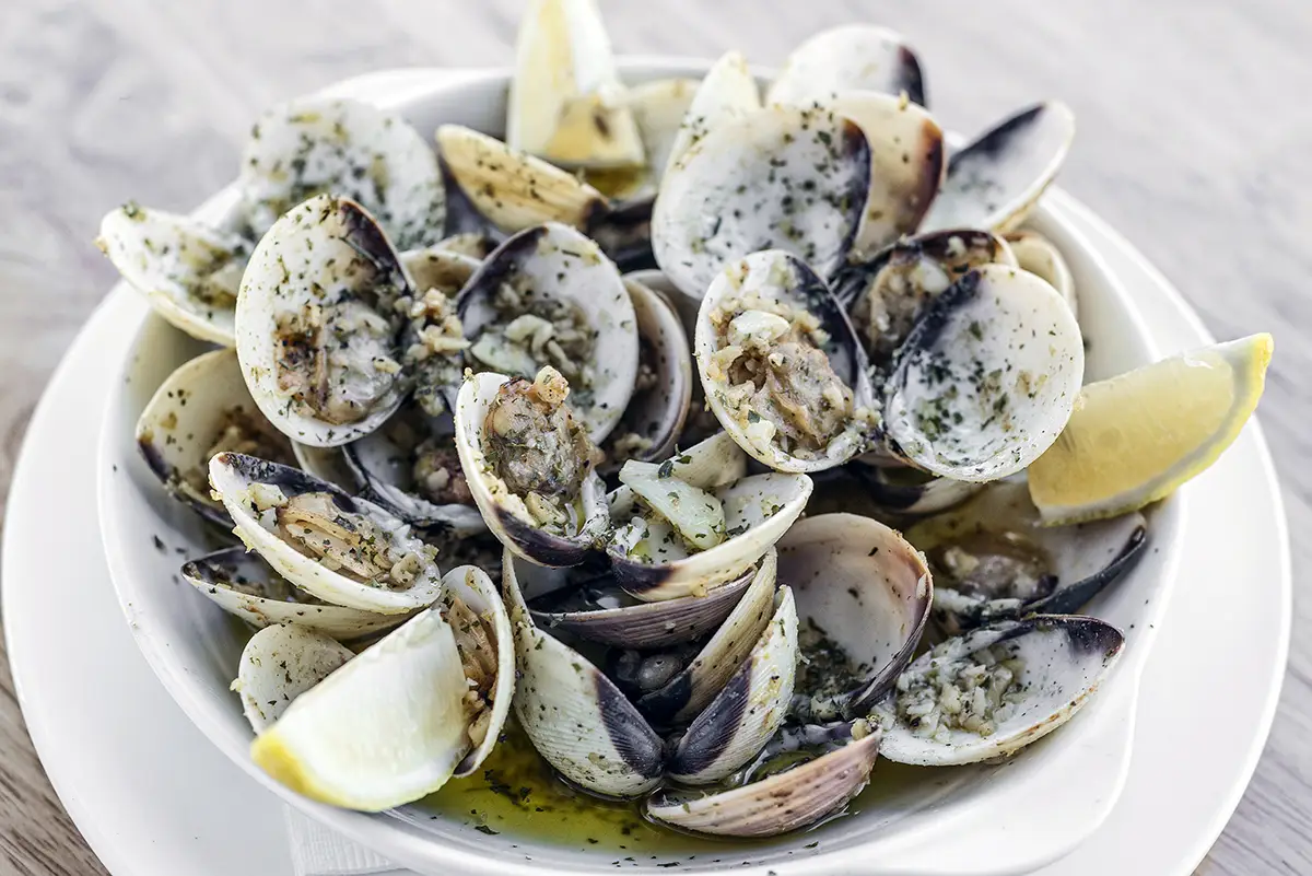 Clams are another sea-based tapa, typically found in every Portuguese restaurant, and served in a special sauce which enhances the flavour.