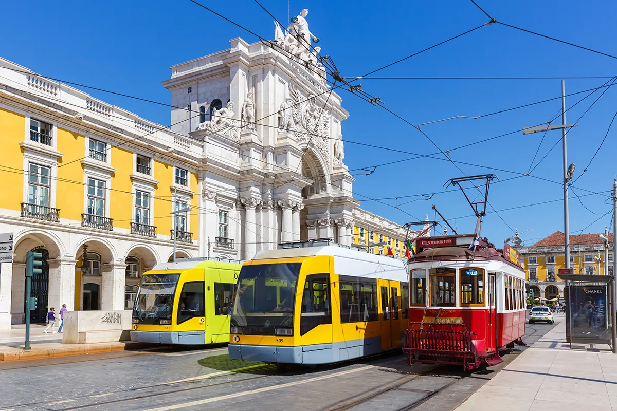 Modern and traditional public trams in the Lisbon city centre.