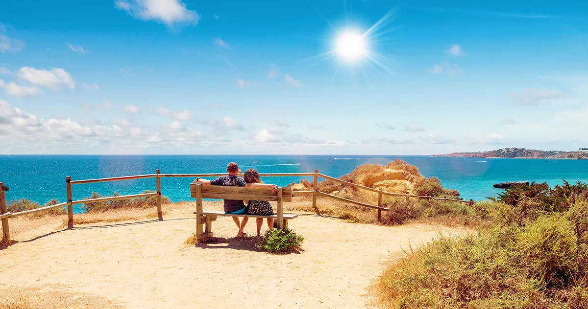 Couple enjoying some good time in the Algarve on a sunny day.