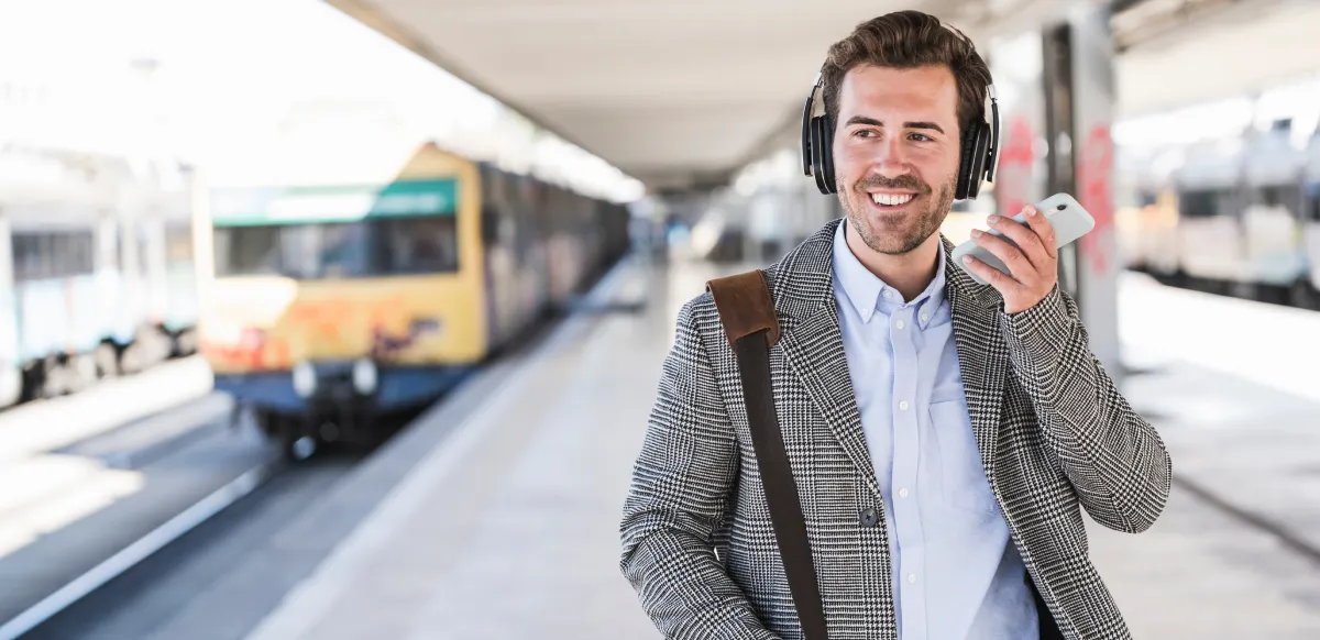 An entrepreneur on an important call while also getting ready to catch the train in Lisbon.