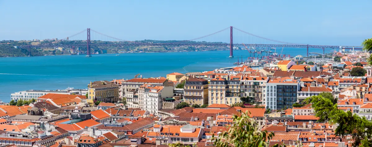 Scenic view of Lisbon, with the Tagus River and the 25th of April bridge in the background.