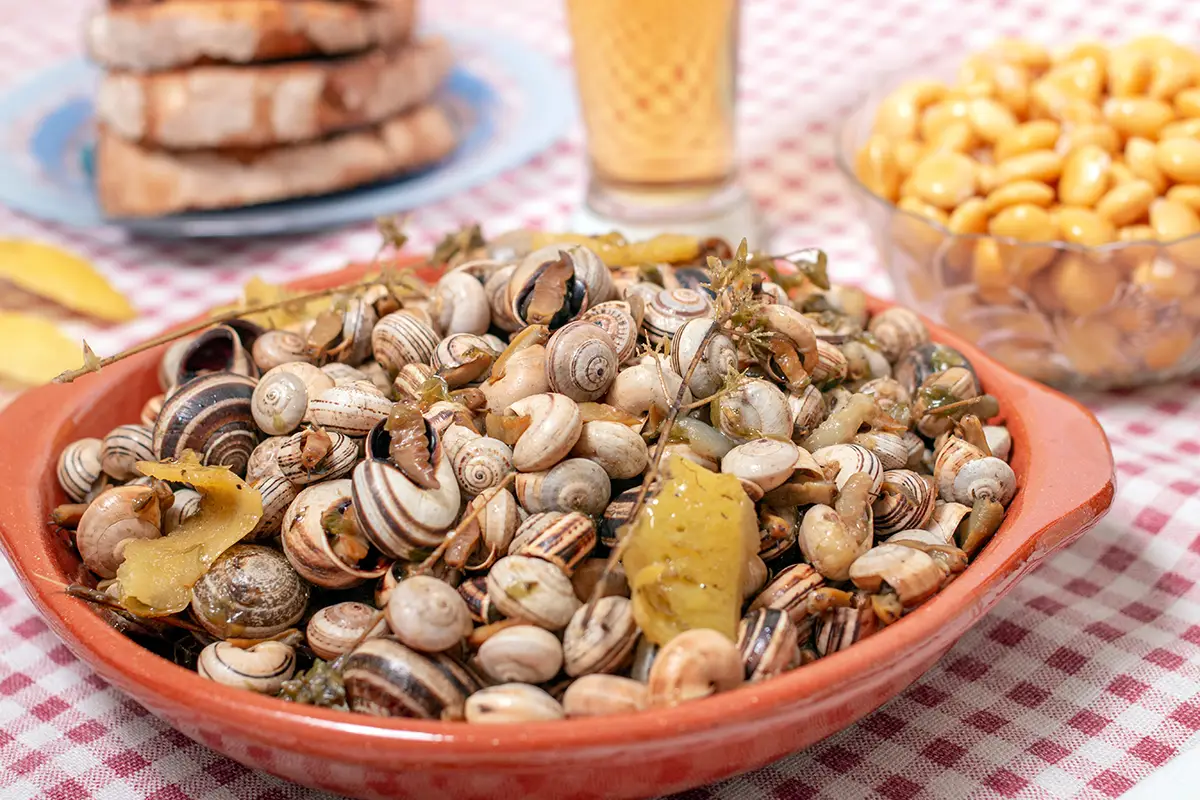 Caracóis, or Portuguese snails, are experty cooked and a typical Portuguese summertime petisco.